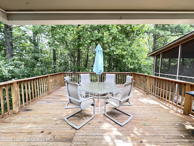 11 Redbud Ct, Dadeville, AL 36853 - wooden deck featuring outdoor dining area and a sunroom