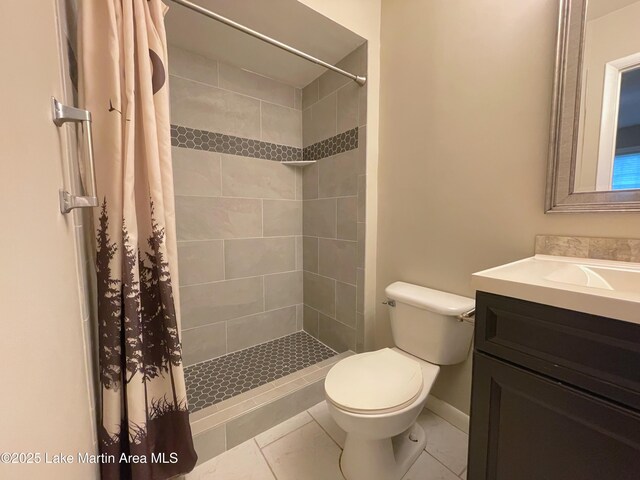 11 Redbud Ct, Dadeville, AL 36853 - bathroom featuring vanity, tiled shower, and tile patterned floors