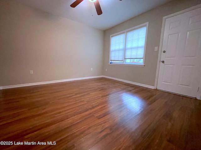 11 Redbud Ct, Dadeville, AL 36853 - empty room with ceiling fan and dark wood-type flooring