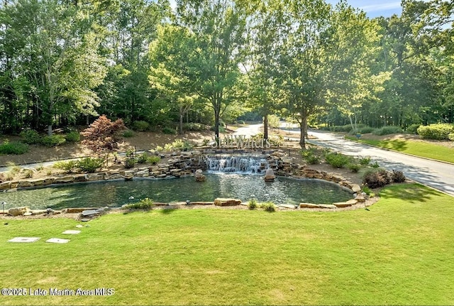 11 Redbud Ct, Dadeville, AL 36853 - view of home's community with a garden pond and a yard