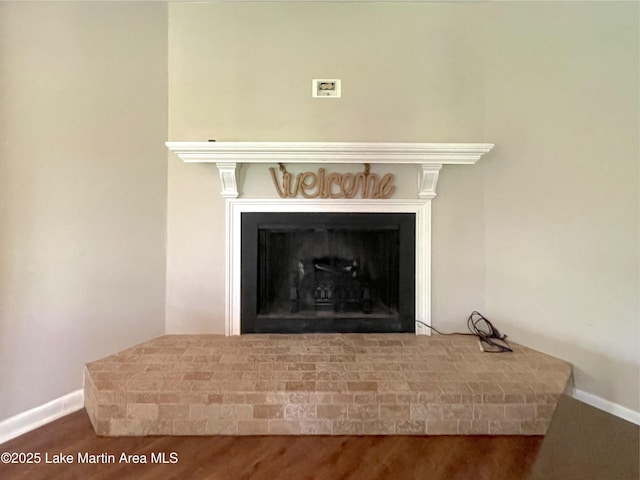 11 Redbud Ct, Dadeville, AL 36853 - detailed view of a fireplace with raised hearth and wood finished floors