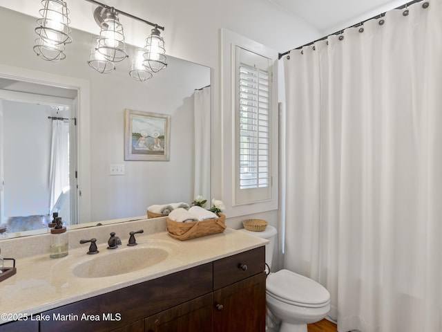 bathroom with vanity and toilet