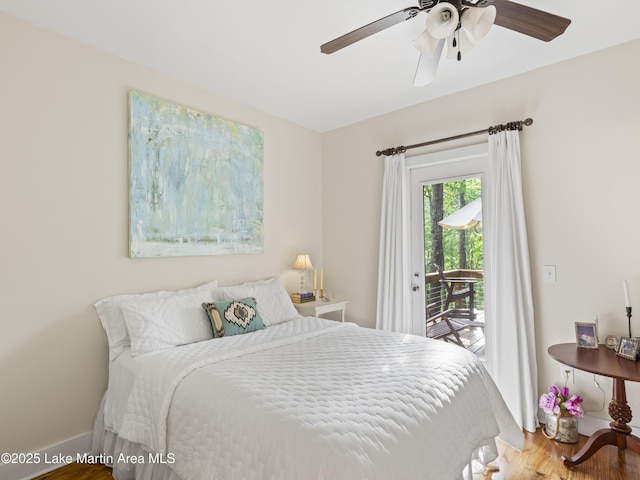 bedroom featuring ceiling fan, hardwood / wood-style floors, and access to outside