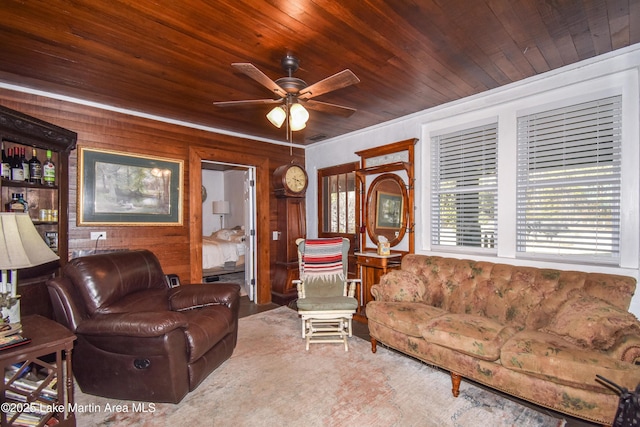 living room featuring wooden walls, wooden ceiling, and ceiling fan