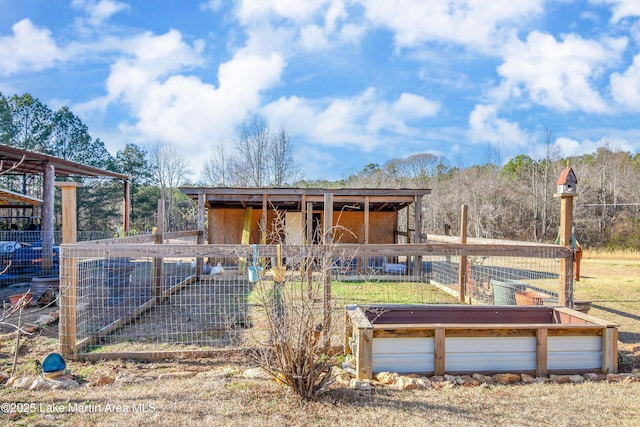 back of property featuring an outbuilding