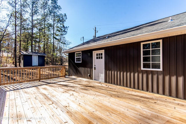 wooden deck with a storage unit