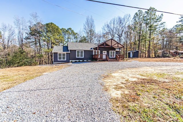 view of front of property with a shed