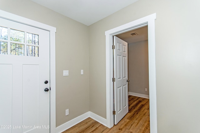 foyer entrance featuring hardwood / wood-style flooring