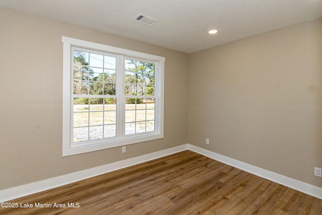 spare room featuring hardwood / wood-style floors