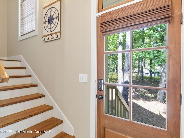 doorway to outside featuring stairs