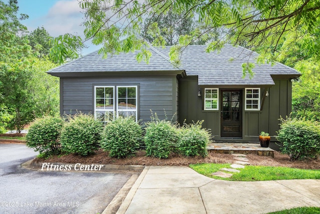 view of front of home with a shingled roof and board and batten siding