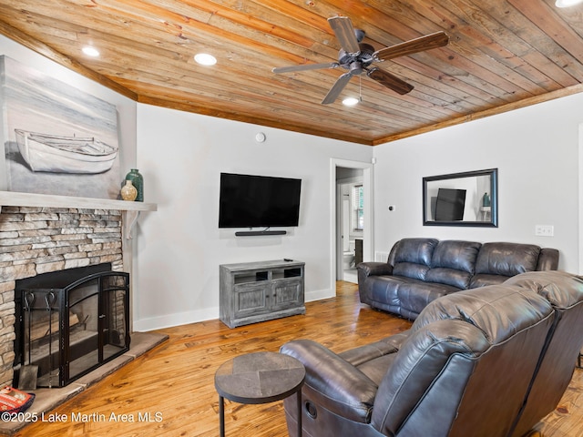 living area featuring a fireplace, wood ceiling, baseboards, ornamental molding, and wood-type flooring