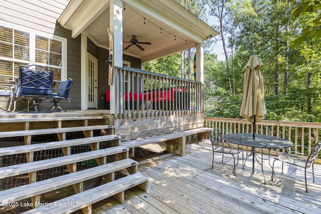 wooden terrace with a ceiling fan