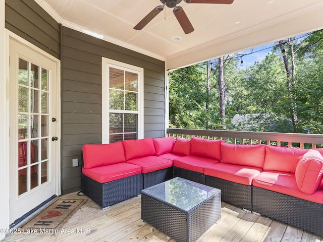 deck with outdoor lounge area, a ceiling fan, and french doors