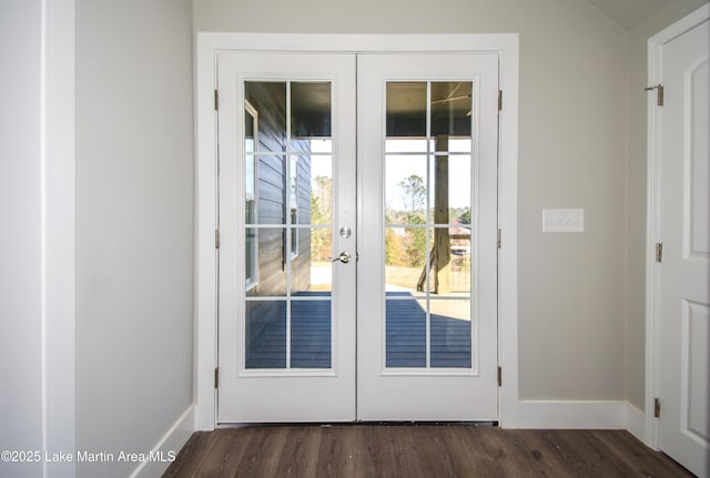 doorway with dark hardwood / wood-style flooring and french doors