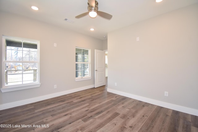 unfurnished room with wood-type flooring and ceiling fan