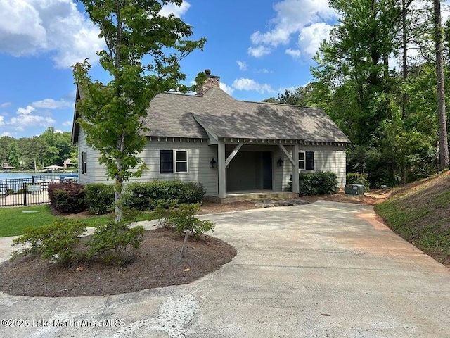 view of front of property with a water view