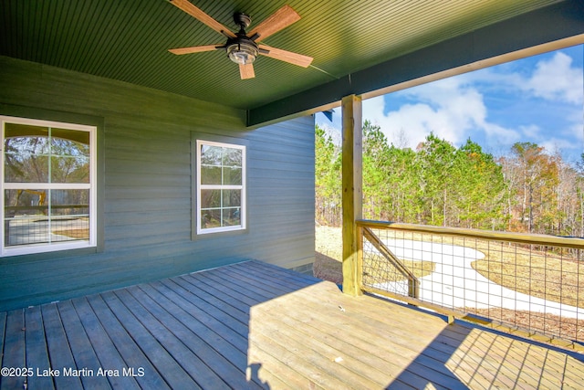 wooden terrace featuring ceiling fan