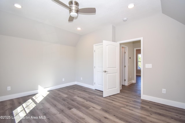 additional living space with dark hardwood / wood-style floors, ceiling fan, and lofted ceiling