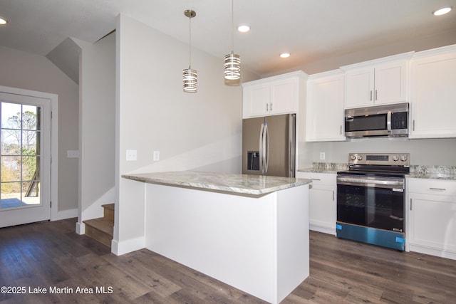 kitchen featuring white cabinets, a wealth of natural light, stainless steel appliances, and hanging light fixtures