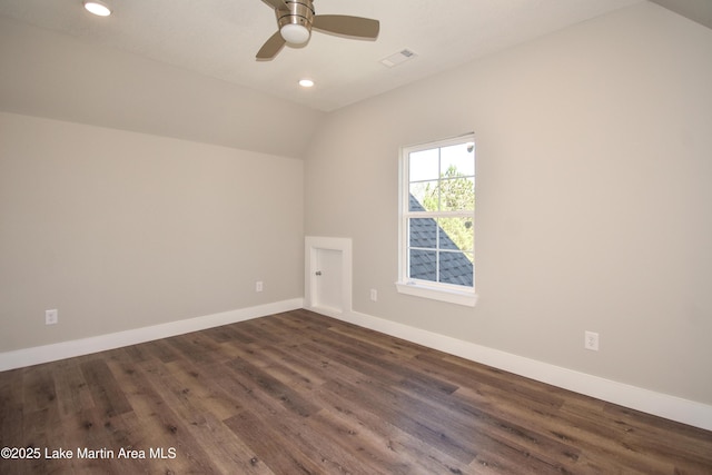 bonus room with dark hardwood / wood-style flooring, vaulted ceiling, and ceiling fan