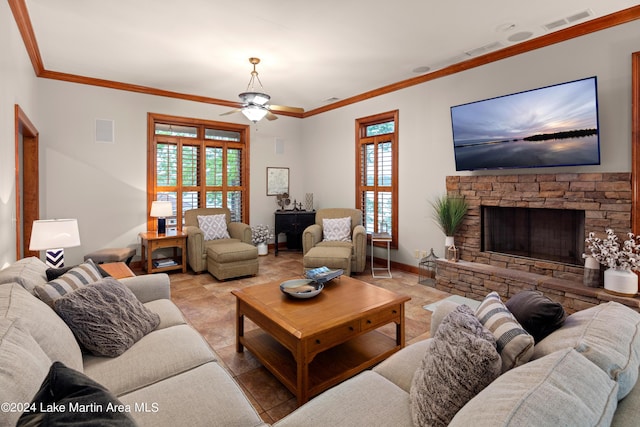 living room with ceiling fan, ornamental molding, and light tile patterned flooring