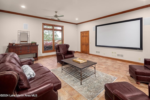 tiled cinema room featuring ceiling fan and crown molding