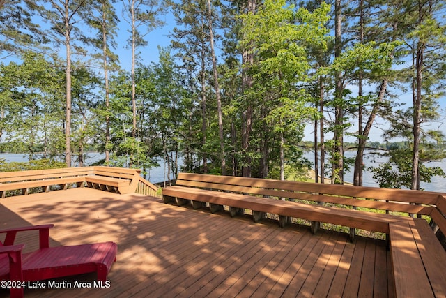 wooden deck with a water view