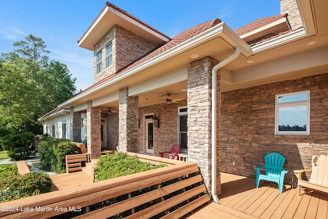 exterior space featuring ceiling fan