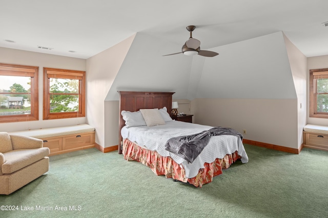 bedroom featuring ceiling fan, light carpet, and vaulted ceiling