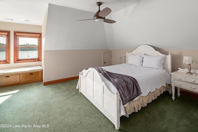 carpeted bedroom with ceiling fan, a water view, and lofted ceiling