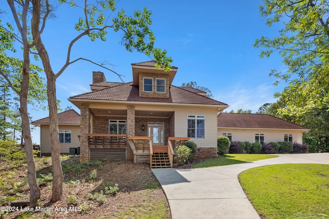 view of front of house featuring a front yard and covered porch