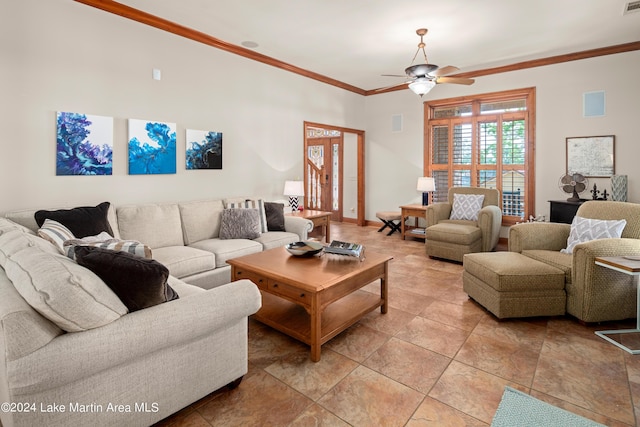 living room featuring ceiling fan and ornamental molding