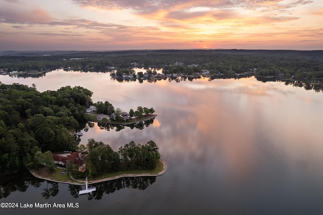 aerial view at dusk with a water view