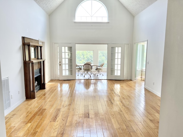 1370 County Road 759, Clanton, AL 35045 - living area with light wood-type flooring, high vaulted ceiling, and a fireplace