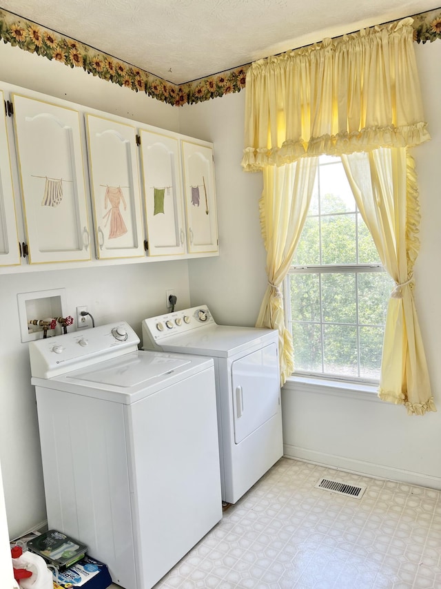 1370 County Road 759, Clanton, AL 35045 - laundry room with cabinet space, washing machine and dryer, and light floors