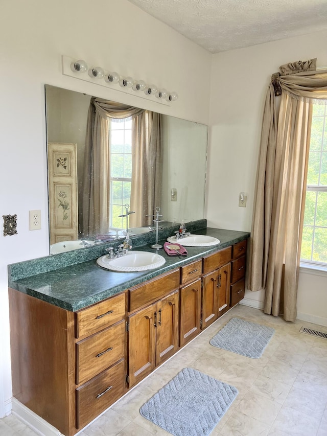 1370 County Road 759, Clanton, AL 35045 - bathroom with double vanity and a textured ceiling