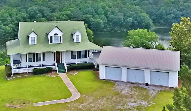 1370 County Road 759, Clanton, AL 35045 - view of front of home featuring covered porch, a detached garage, an outbuilding, and a forest view