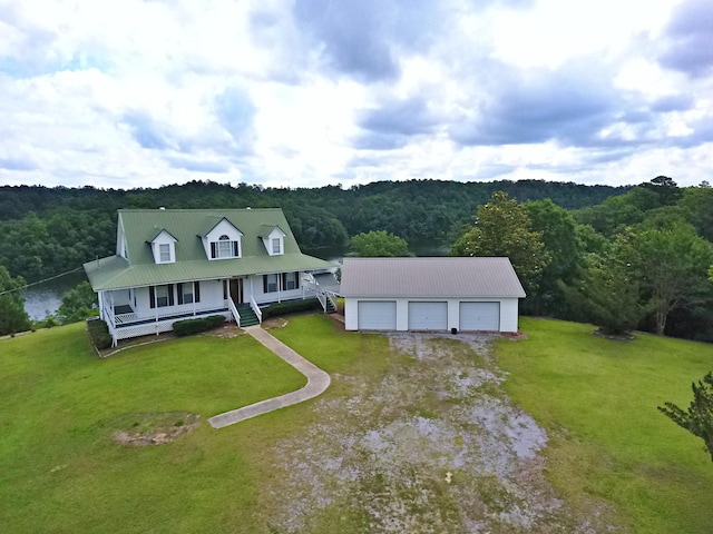 1370 County Road 759, Clanton, AL 35045 - view of front of property with a garage, a forest view, covered porch, and a front lawn