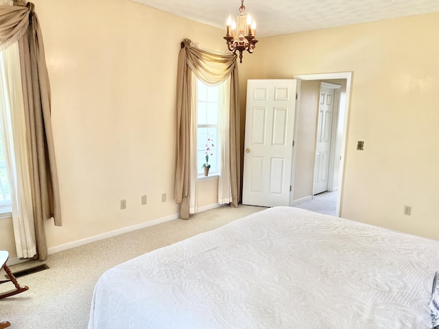 1370 County Road 759, Clanton, AL 35045 - bedroom featuring light colored carpet and a chandelier