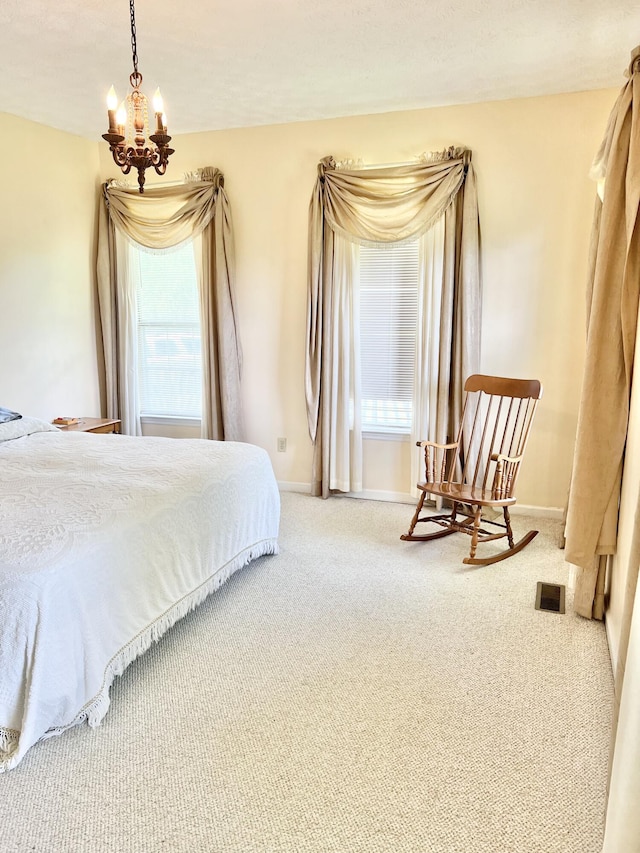 1370 County Road 759, Clanton, AL 35045 - carpeted bedroom with baseboards and a chandelier