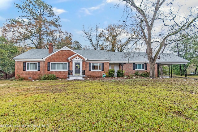 ranch-style home featuring a carport and a front yard