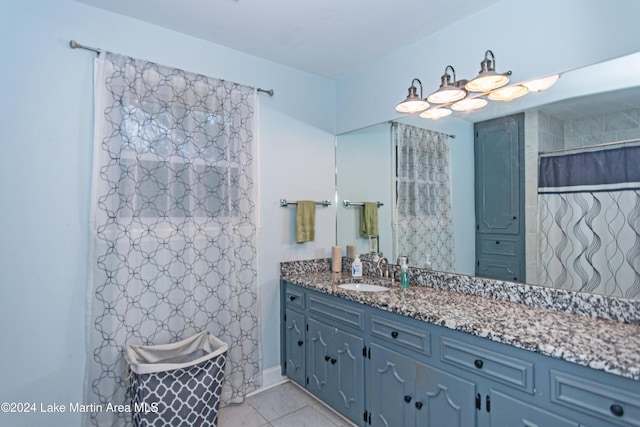 bathroom with vanity and tile patterned floors