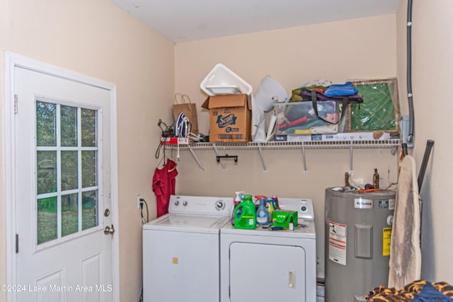 laundry area with washer and dryer and water heater