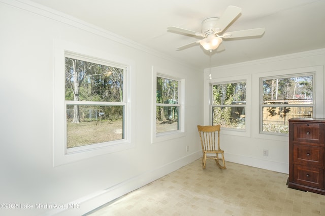 sunroom / solarium with ceiling fan and plenty of natural light