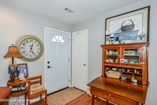 3464 Dobbs Rd, Alexander City, AL 35010 - foyer with wood finished floors and a textured ceiling