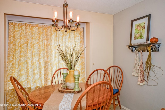 3464 Dobbs Rd, Alexander City, AL 35010 - dining room featuring a chandelier and a textured ceiling
