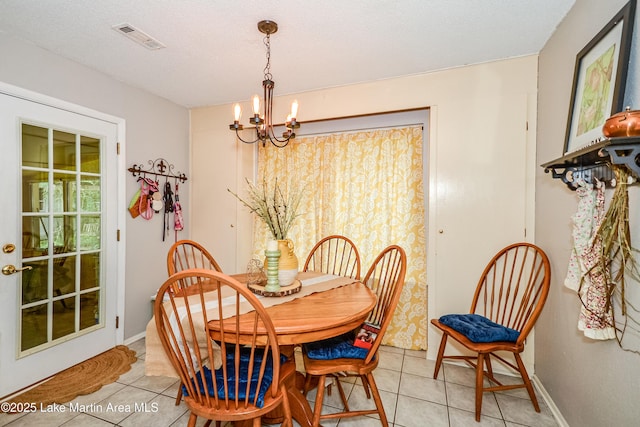 3464 Dobbs Rd, Alexander City, AL 35010 - dining space with a chandelier and light tile patterned floors