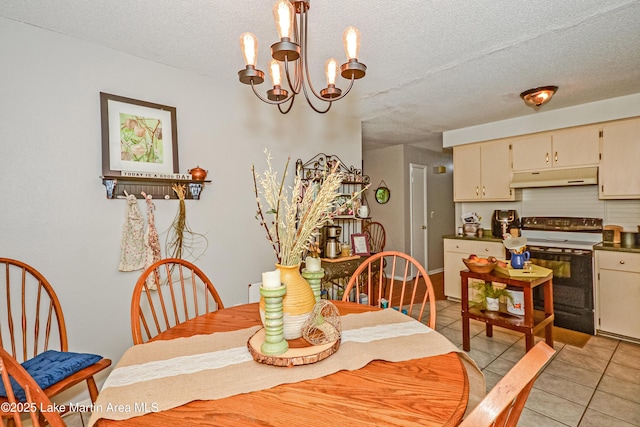 3464 Dobbs Rd, Alexander City, AL 35010 - dining space with a chandelier, light tile patterned floors, and a textured ceiling