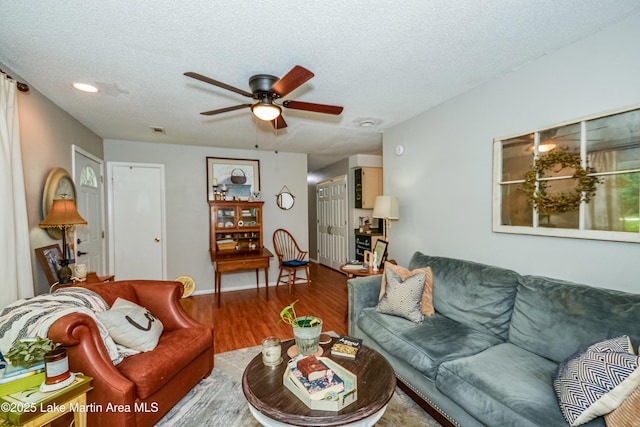 3464 Dobbs Rd, Alexander City, AL 35010 - living area with a ceiling fan, wood finished floors, a textured ceiling, and recessed lighting